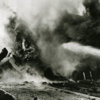 P-47 Thunderbolt and the home of Eunice and Bernard Fixler (Hofstra University Class of 1941) both engulfed in flames