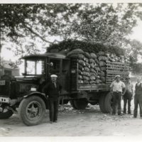 Unidentified men alongside market truck at Rushmore Farms. LAR, Sr., possible 2nd from right, Sep. 1937.jpg