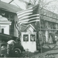 Garden City Garage with a Luscombe 8A airplane in front of the building